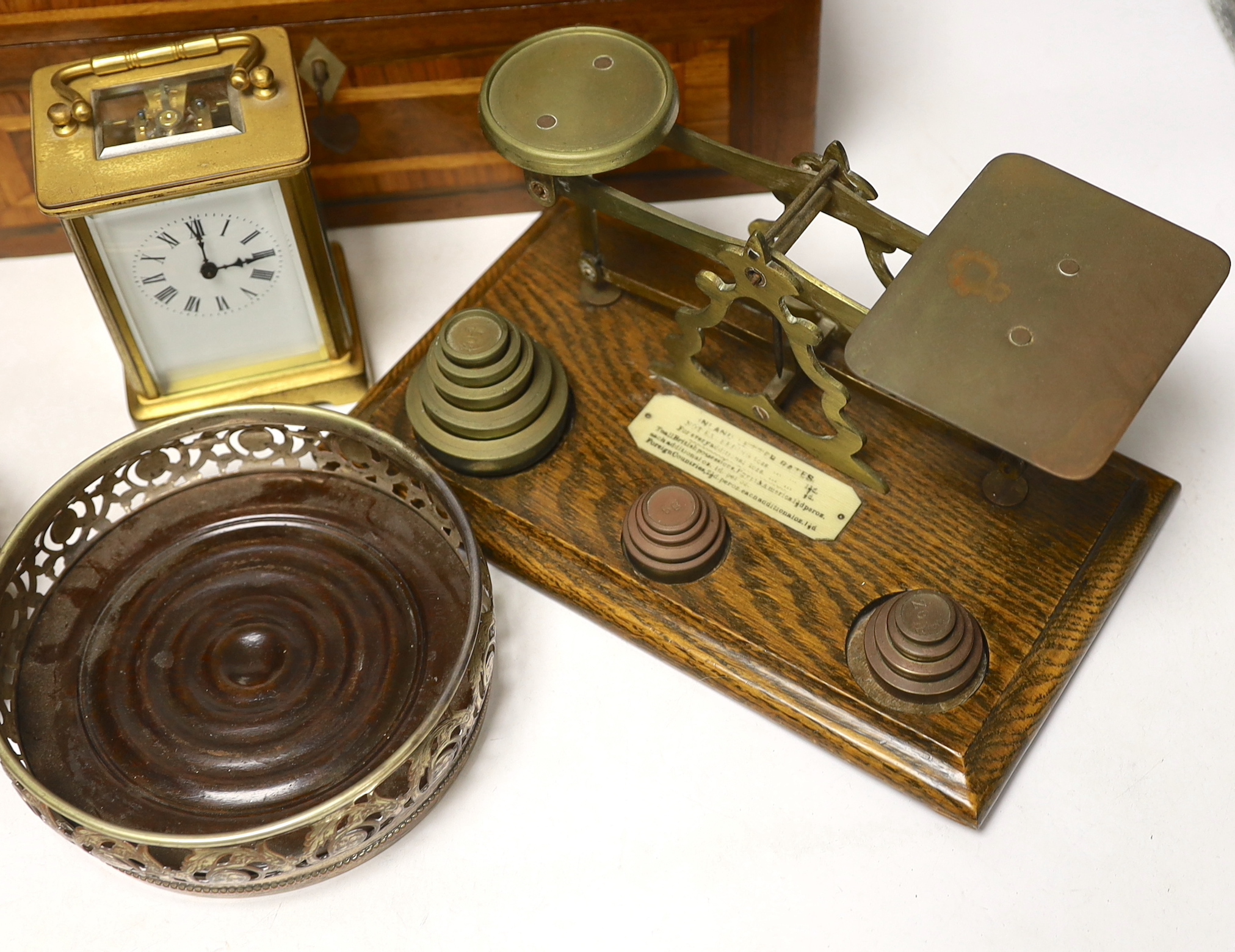 Letter scales and weights, a inlaid box, a carved box, a pair of plated coasters, carriage clock, inlaid box 33cm wide x 13cm high